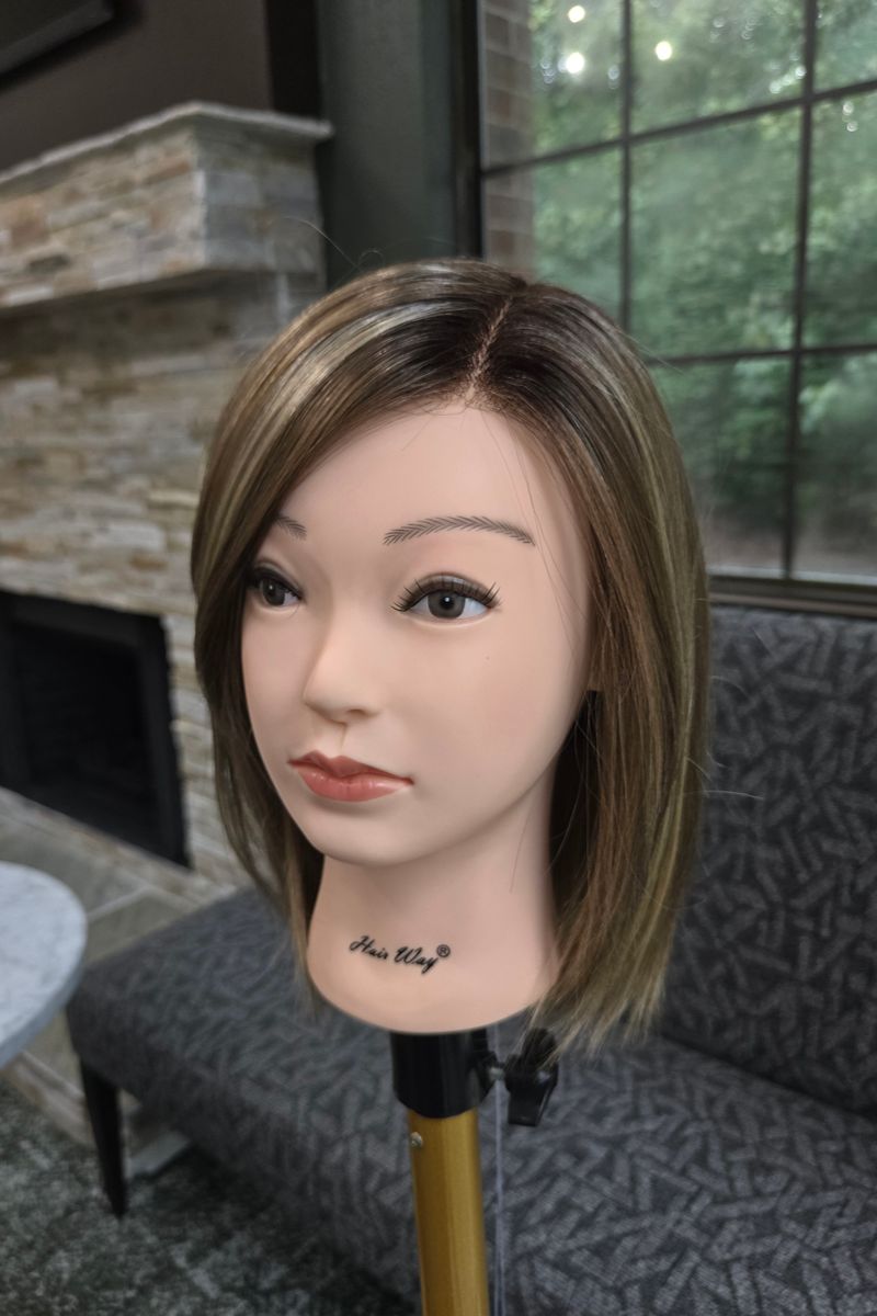 Shai is a straight, medium-length synthetic style.