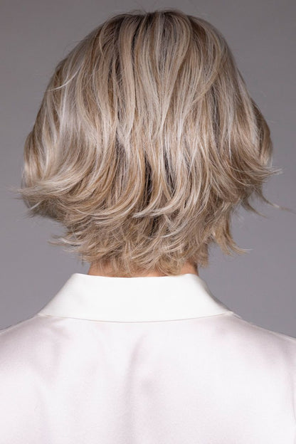 Marni Wig by Belle Tress in Butterbeer R 10/60/88+8 | Butterbeer Root hair color is an inviting blend that exudes a cozy, radiant charm. The roots feature soft dimensions of brown base with a touch of depth, giving a natural and lived-in look. This transitions smoothly into a buttery blonde, infused with creamy honey and toffee tones that shimmer like the frothy top of a freshly poured butterbeer.